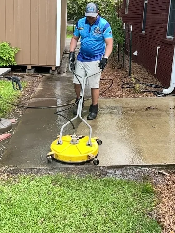 Surface cleaner being run across a concrete driveway