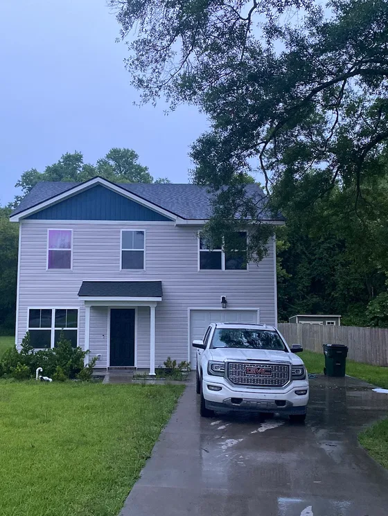 Two story home and driveway cleaned down